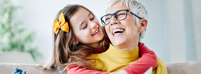 Grandma and granddaughter hugging