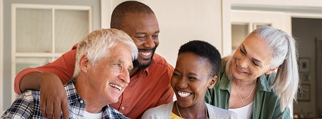 Multiracial and multigenerational group smiling together