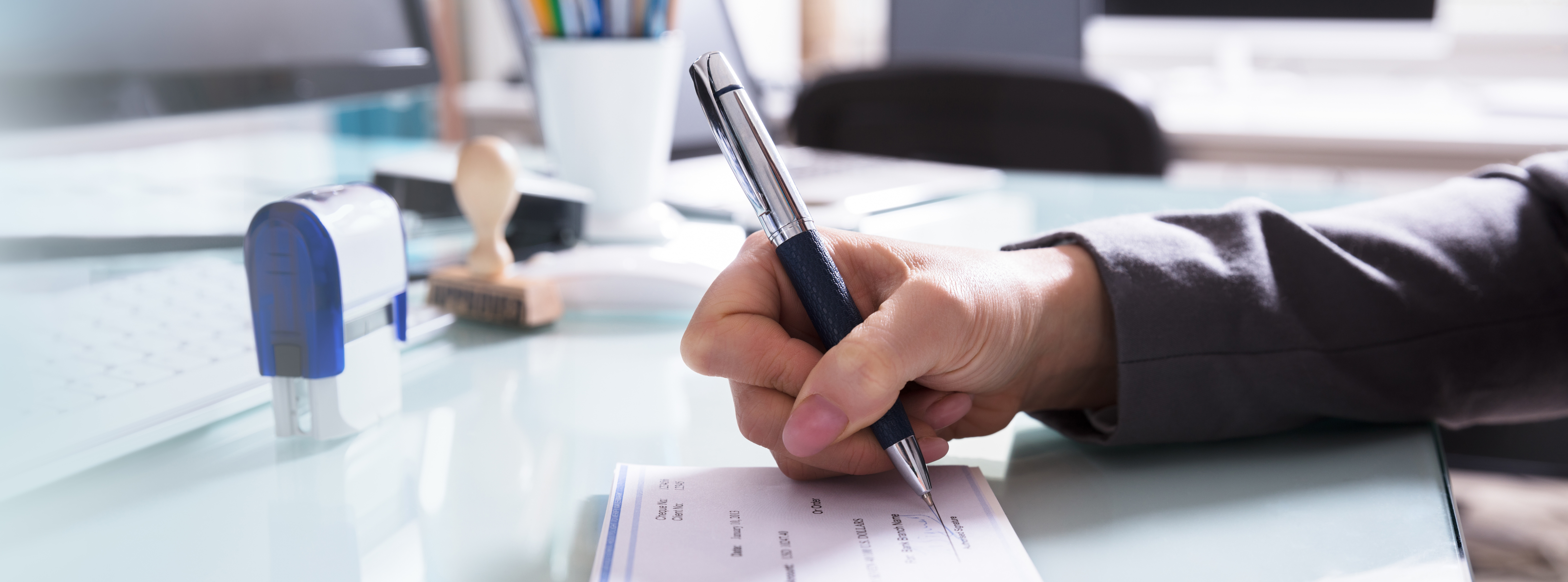 Woman writing out a check