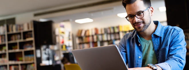 College student looking at laptop