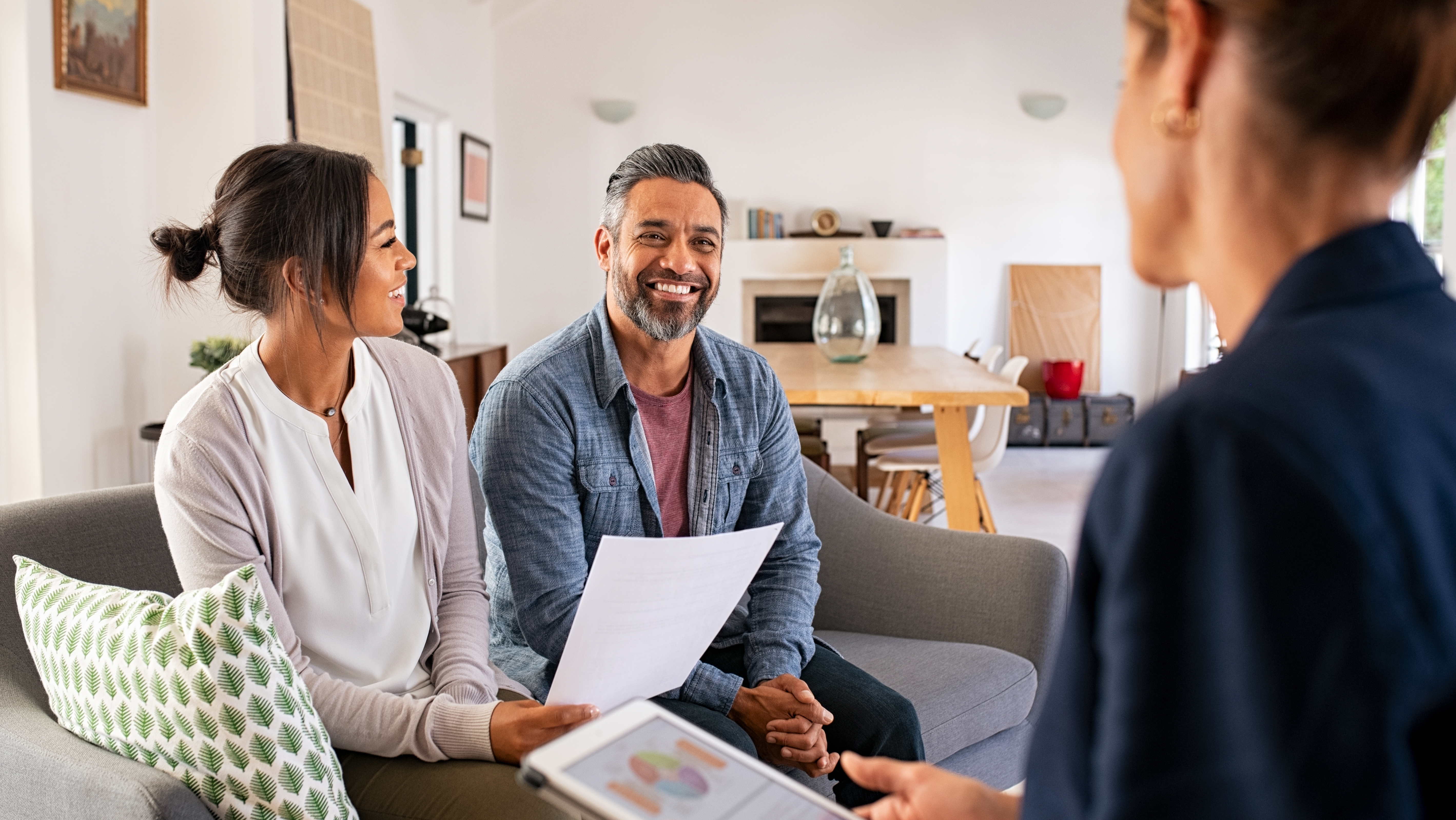 Couple meeting with professional consultant in their home