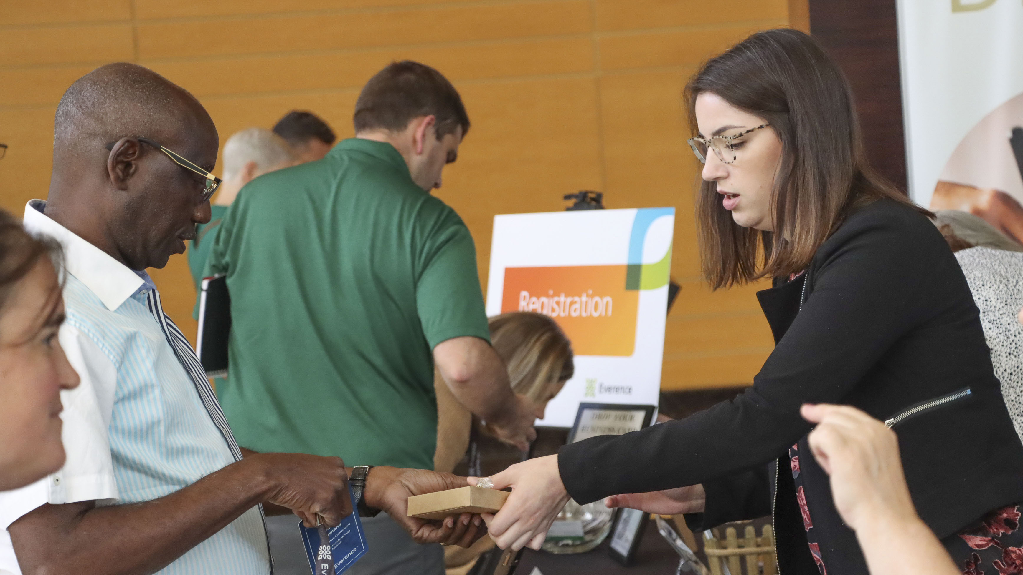 Attendees check-in at the 2023 Everence Development Conference registration table.