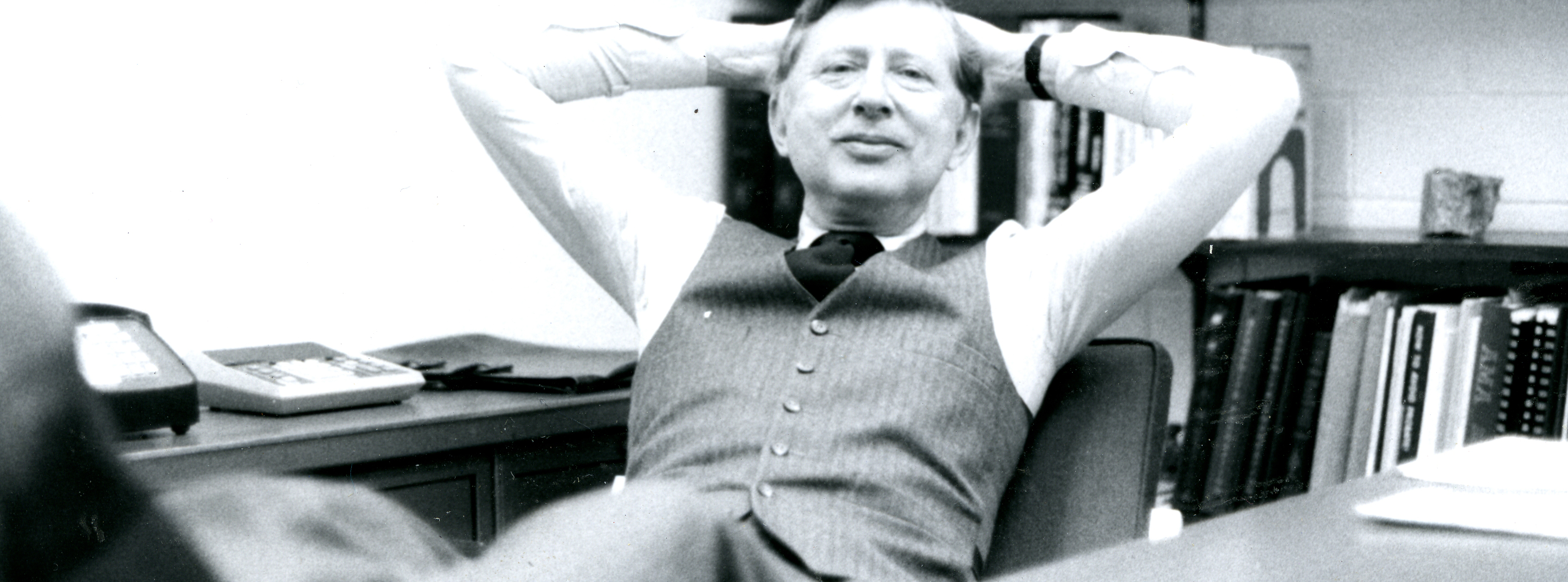 John Rudy, former leader of Everence Foundation (Mennonite Foundation), leans back casually at his desk