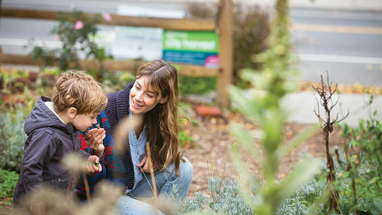 Vanessa Caruso and son in garden