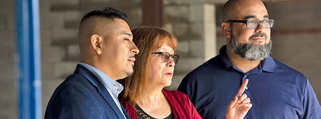 Sergio Nava, Gina Rodriguez, Esdras Ferreras from Sonido de Alabanza inside construction for new church