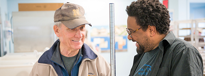 Volunteer Dan Cooper talks with Executive Director of Meals on Wheels of Lancaster Kevin Ressler