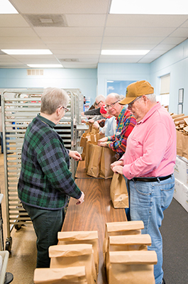 Loading bags with food