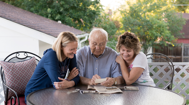 Don Schierling with daughters at table