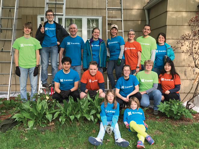 Everence employees and friends gather for a LaCasa Help-A-House day in Goshen, Indiana. Group of volunteers in Everence T-shirts