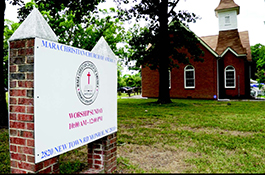 Small red church with signage, Mara Christian church 