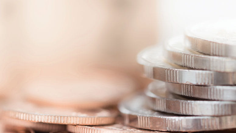 A closeup photo of a pile of coins