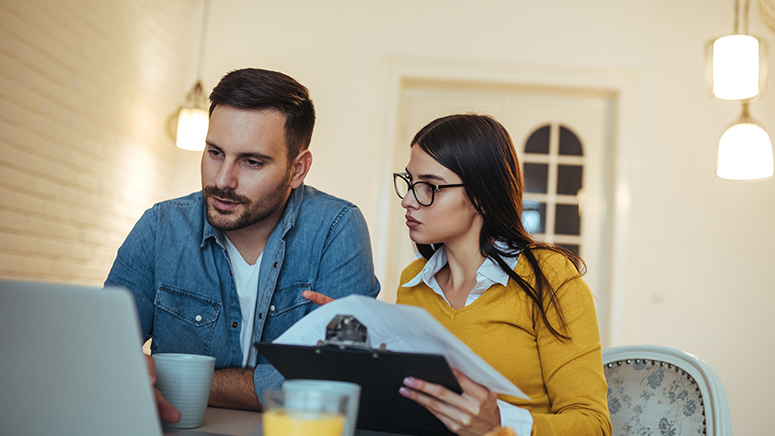 Couple reviewing something on computer