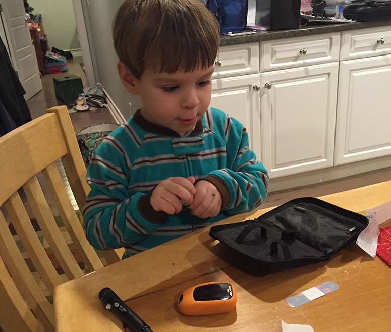 3-year-old little boy Will Gibbs checks his blood pressure