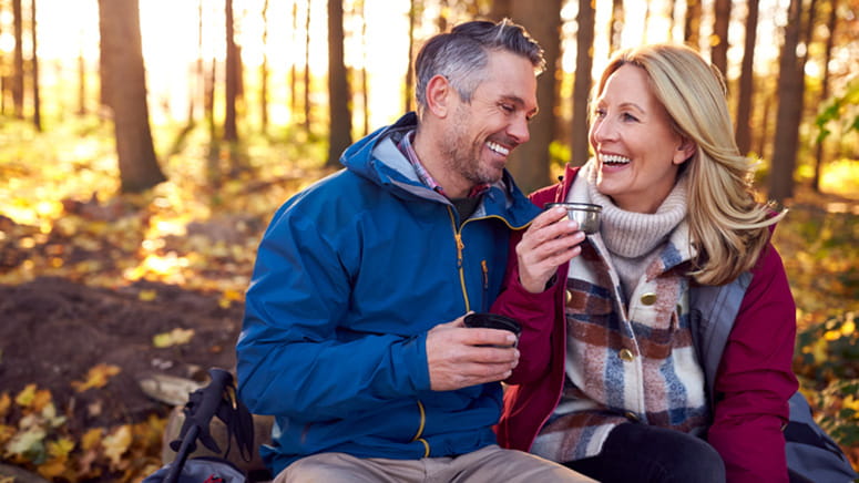 Couple in nature smiling 