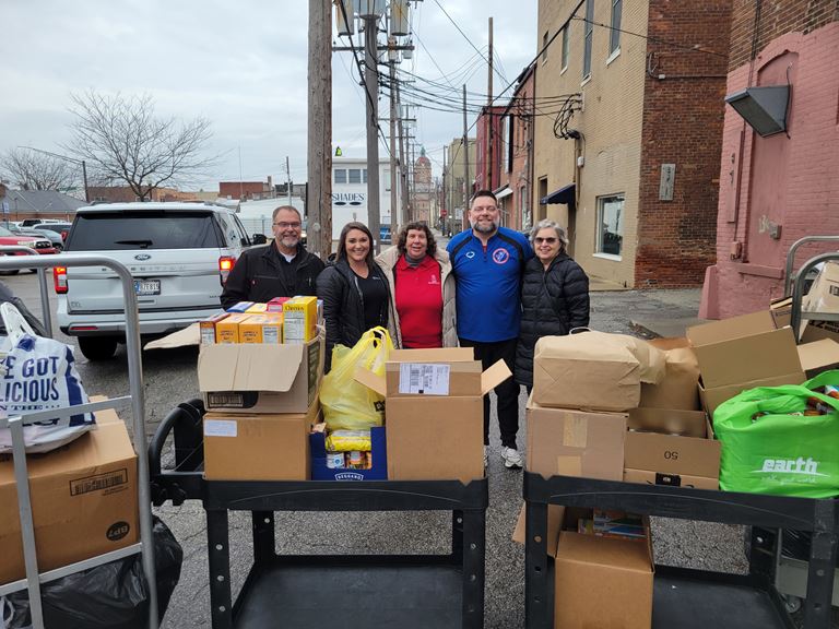 Everence employees drop off donations to The Window