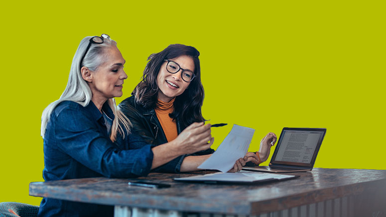 Two women talking about a business plan