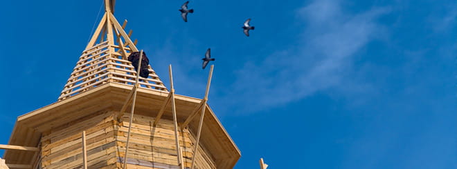 A church steeple under construction