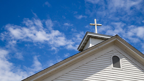 Church steeple against a blue sky