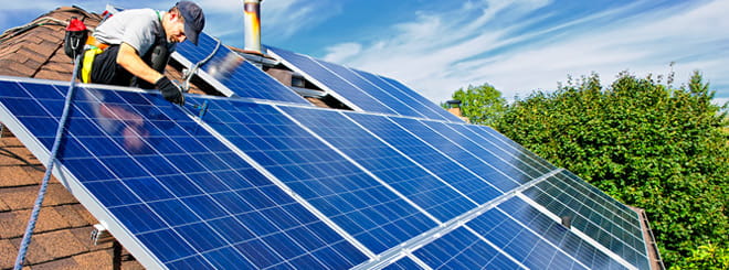 Solar panels being installed on a rooftop