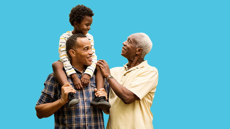 Dad with son on shoulders and grandpa