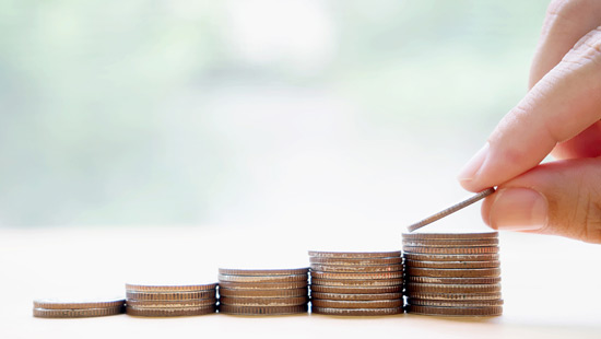 A stack of coins progressively growing