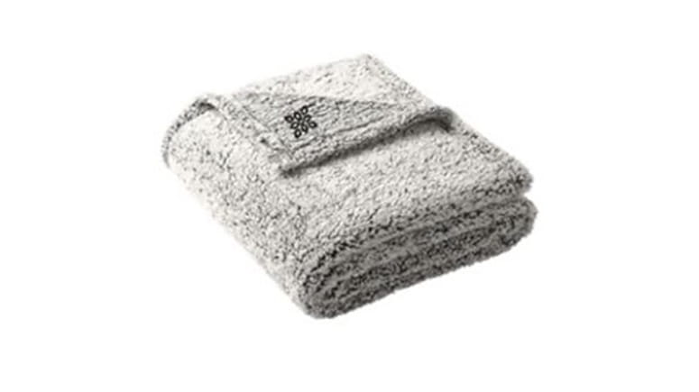 Fuzzy, fleece gray blanket with black logo.