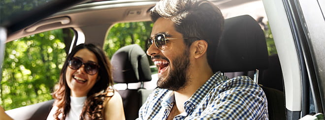 Couple laughing in car