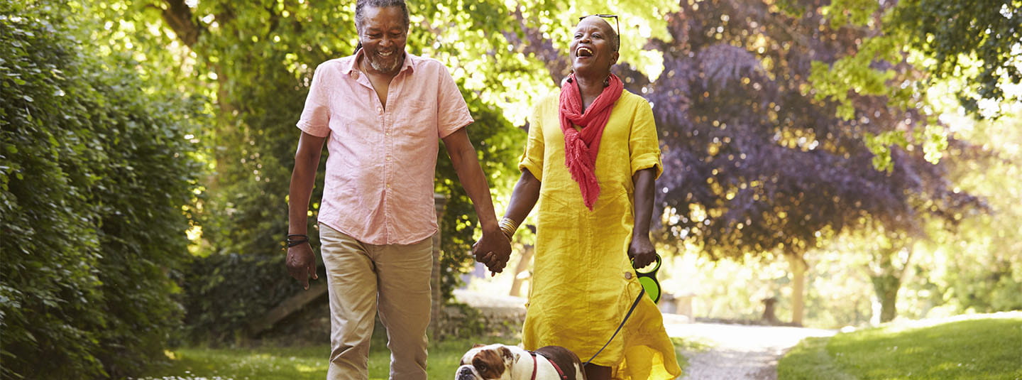 Couple walking dog