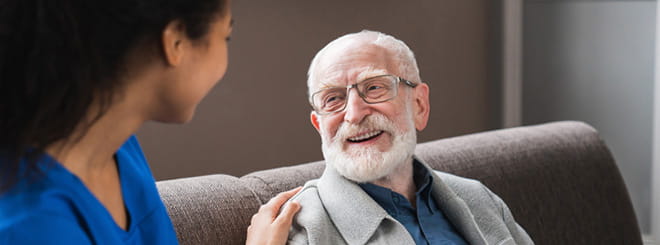 Woman talking to older man 