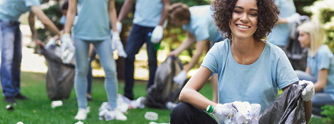 Group of volunteers cleaning park