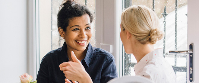 Two woman chatting