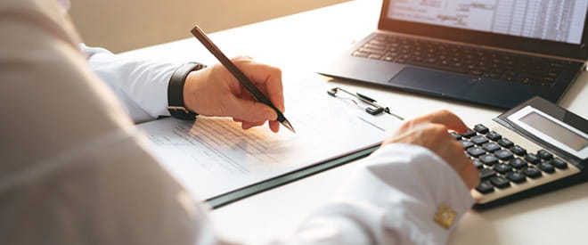 Man filling out paperwork