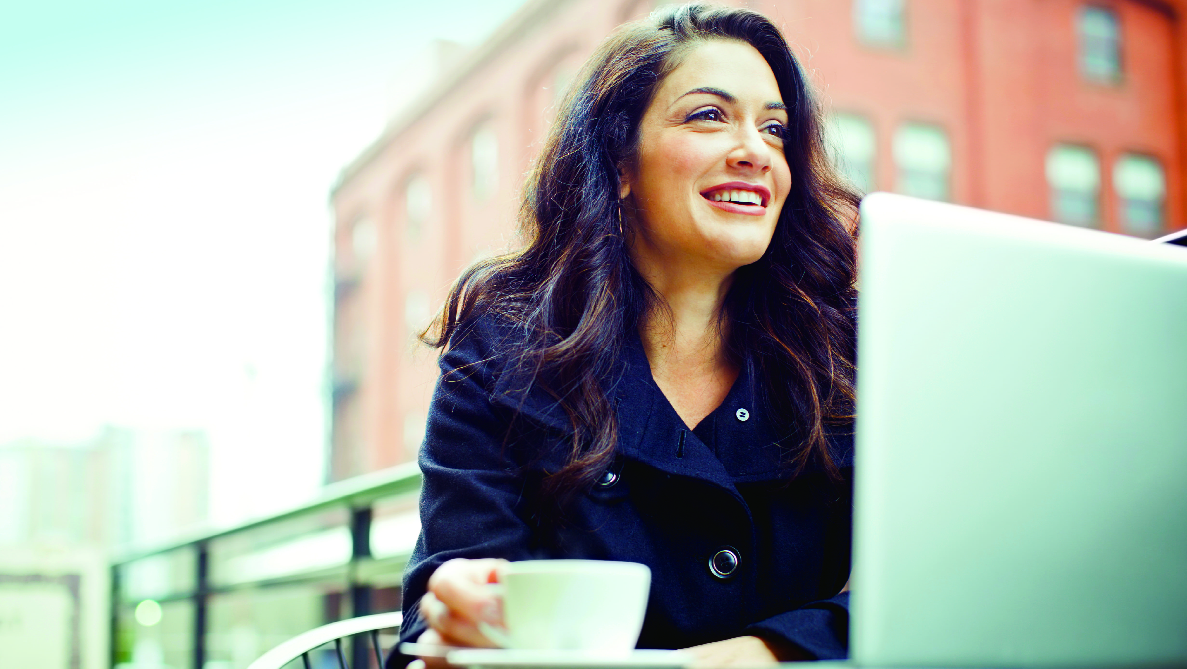 Women doing work at a coffee shop 