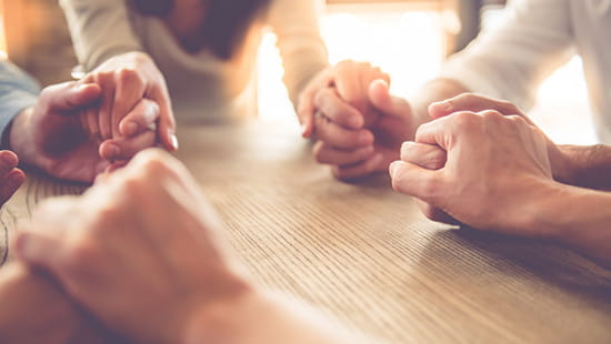 Group of believers praying together