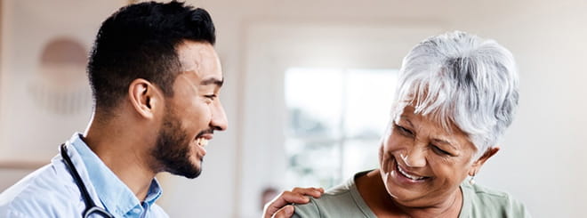 Doctor having conversation with older woman