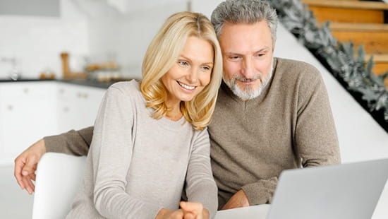 Older couple looking at laptop