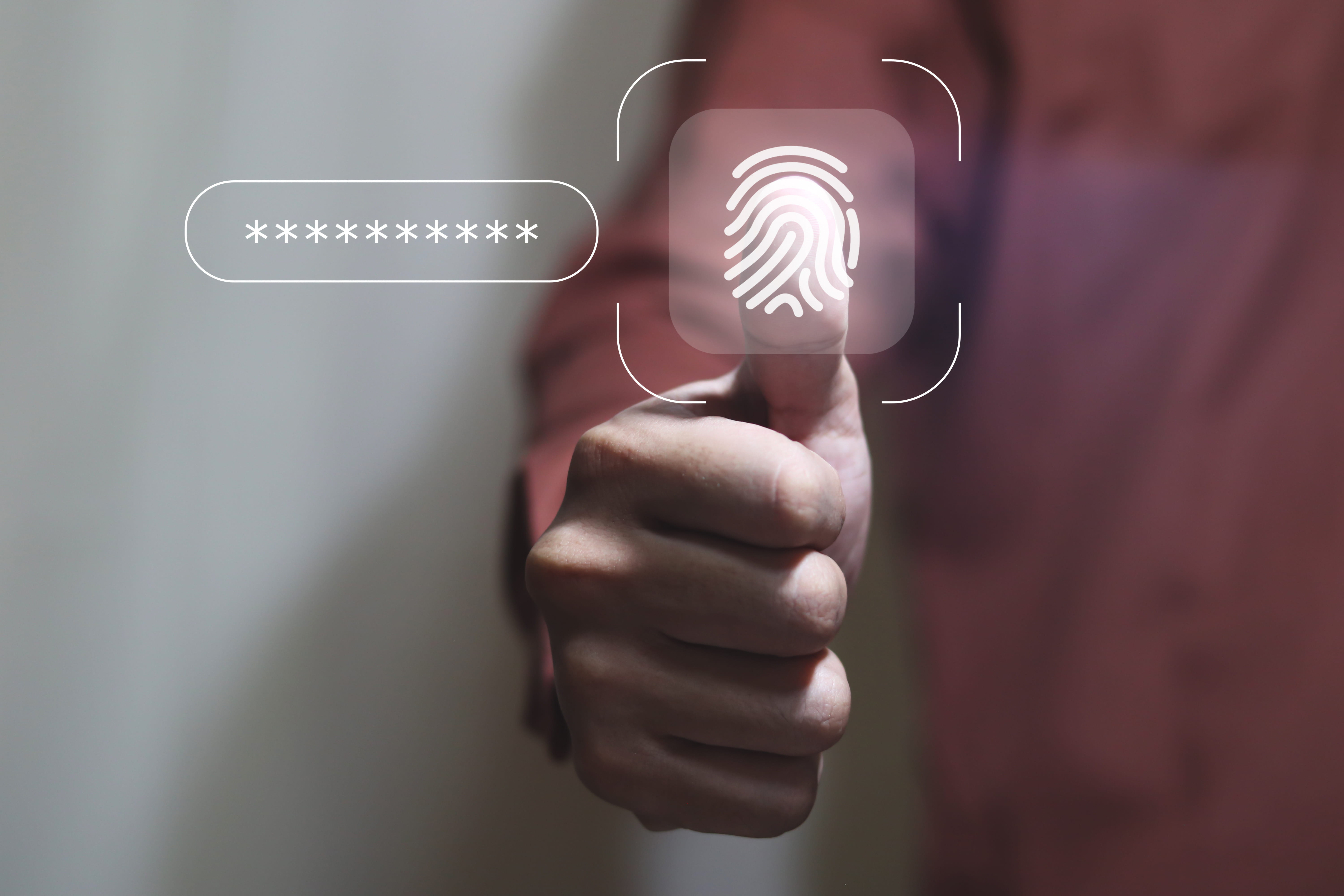 Man with thumb against a security thumb scanner and password astericks