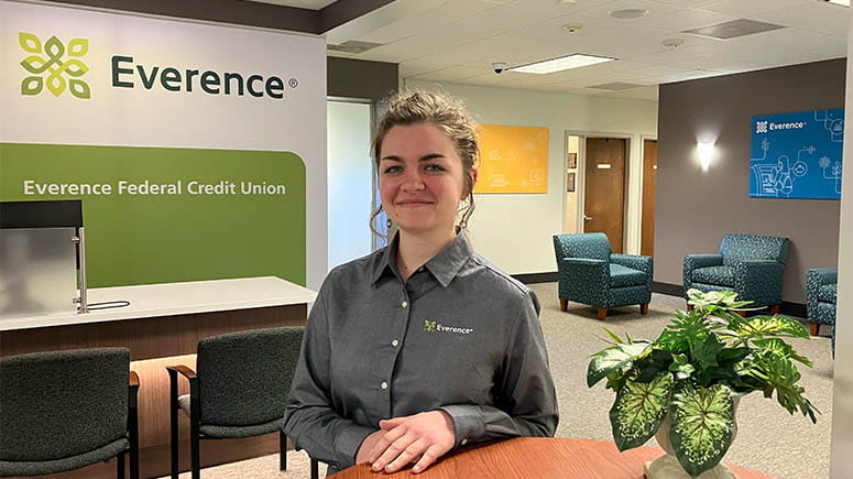 Everence employee stands in front of the newly renovated Mount Joy Everence Federal Credit Union interior.