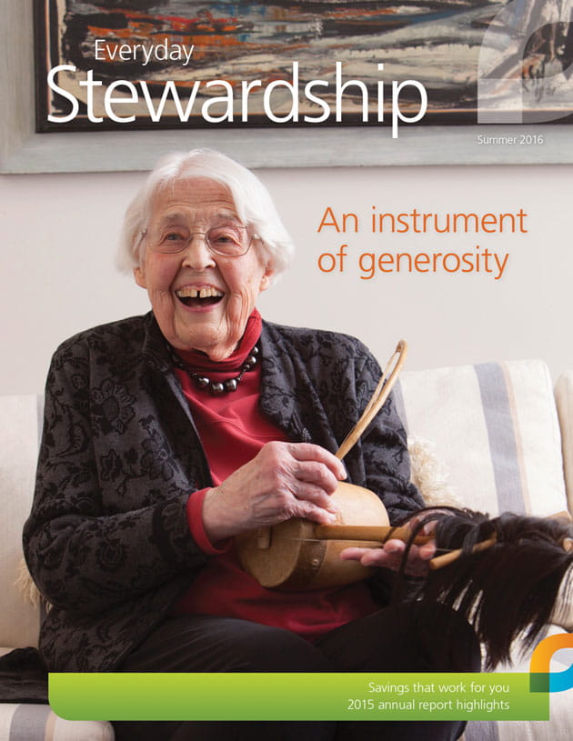 90 year old Goshen (Indiana) College Professor Mary K. Oyer  holds a one-string fiddle