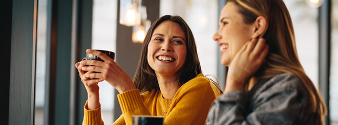 Two woman laughing