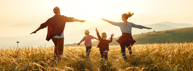 Family playing in field