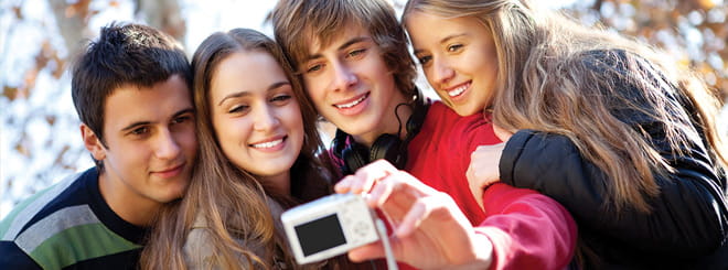 A group of young people taking a picture together