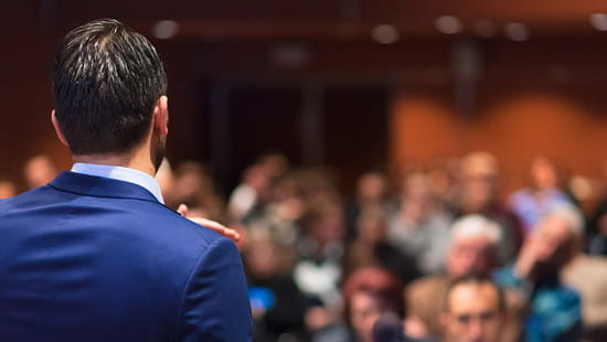 Speaker addressing a group of people